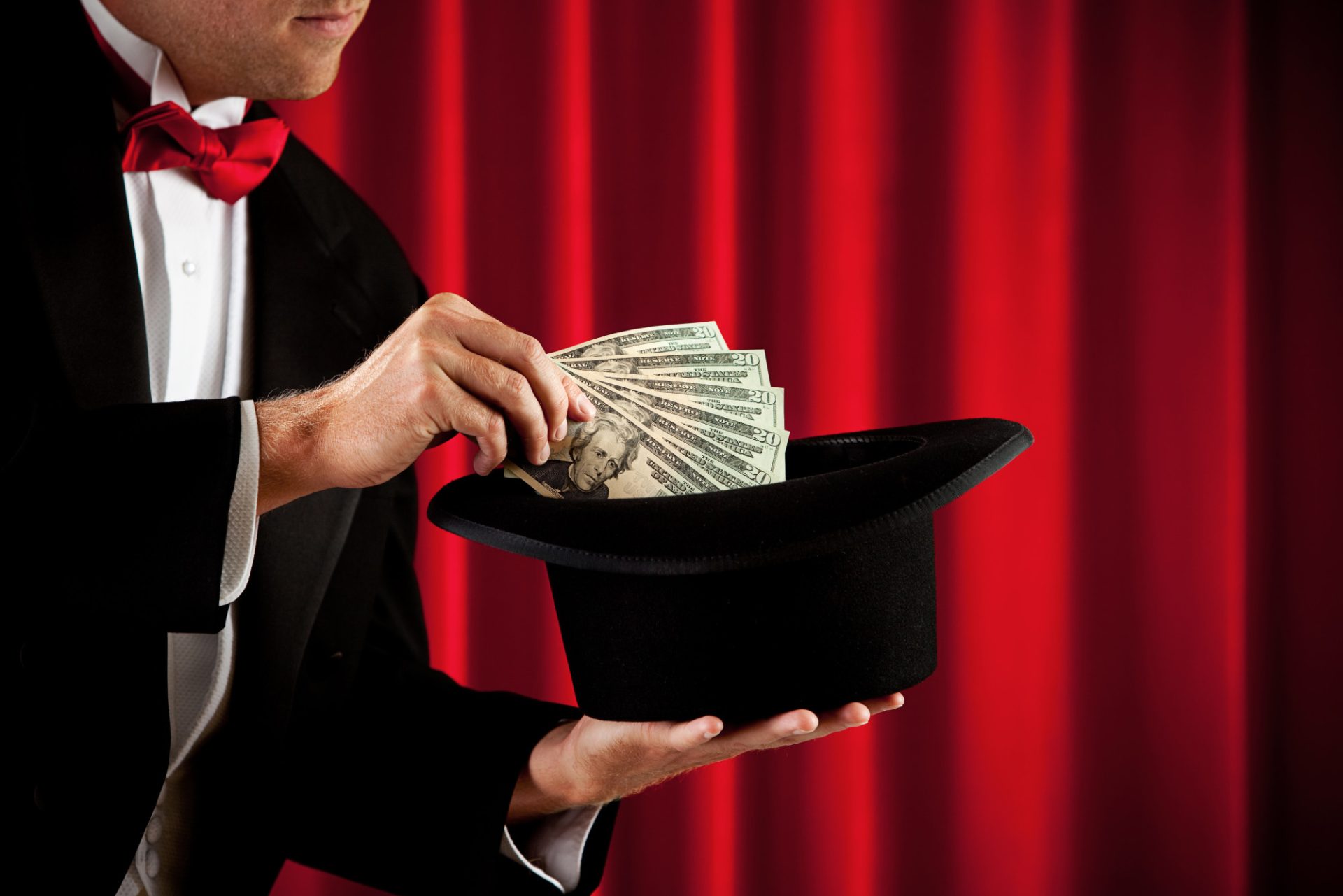 magician in a traditional tuxedo, with various props, looking mysterious and magical.